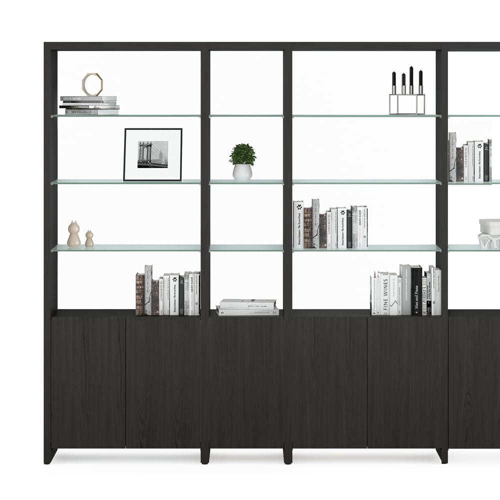 Black shelving system with cabinet and glass shelves.