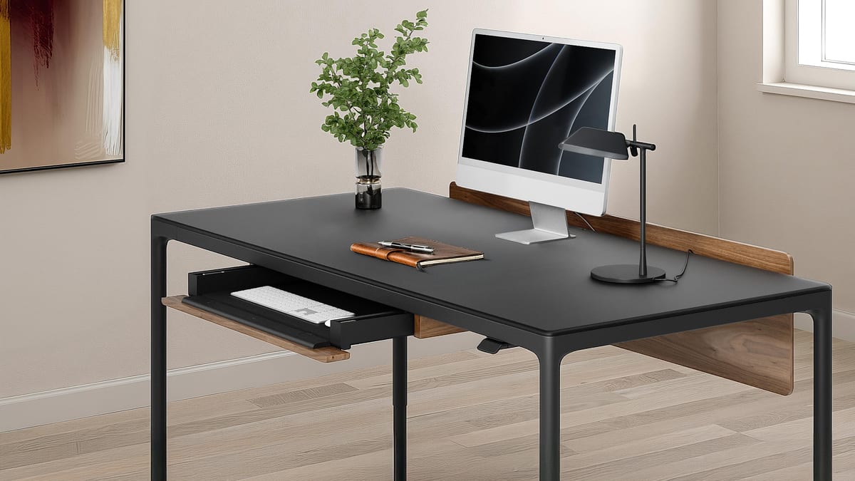 BDI Luma 6763 Sit+Stand desk in Black shown with the optional Keyboard+Storage Drawer open.