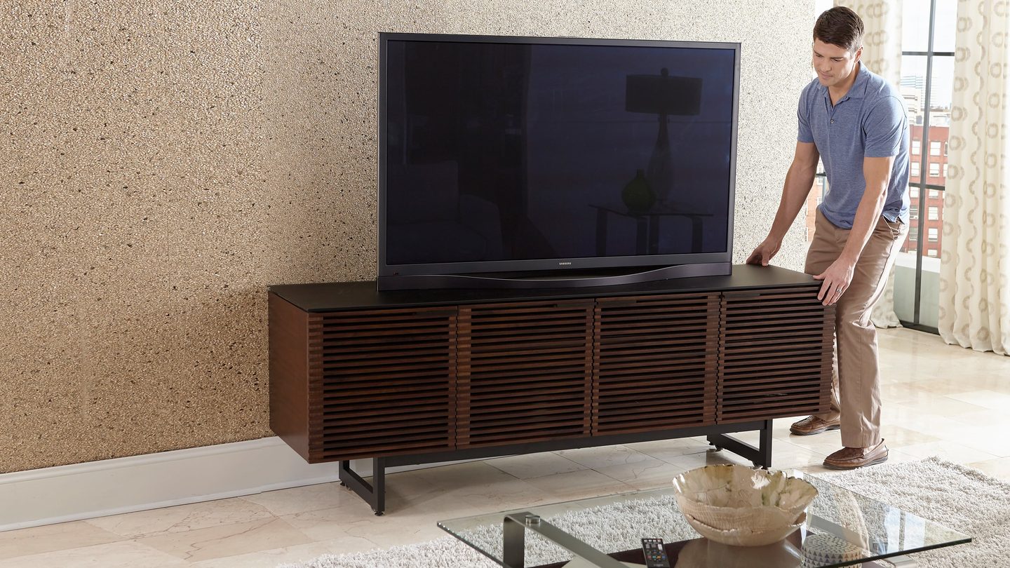 Concealed wheels make the Corridor 8179 home theater cabinet easy to move—and cables easy to access—while preserving the clean lines of the durable steel base. Lower the levelers to raise it off the wheels to secure it in place.
