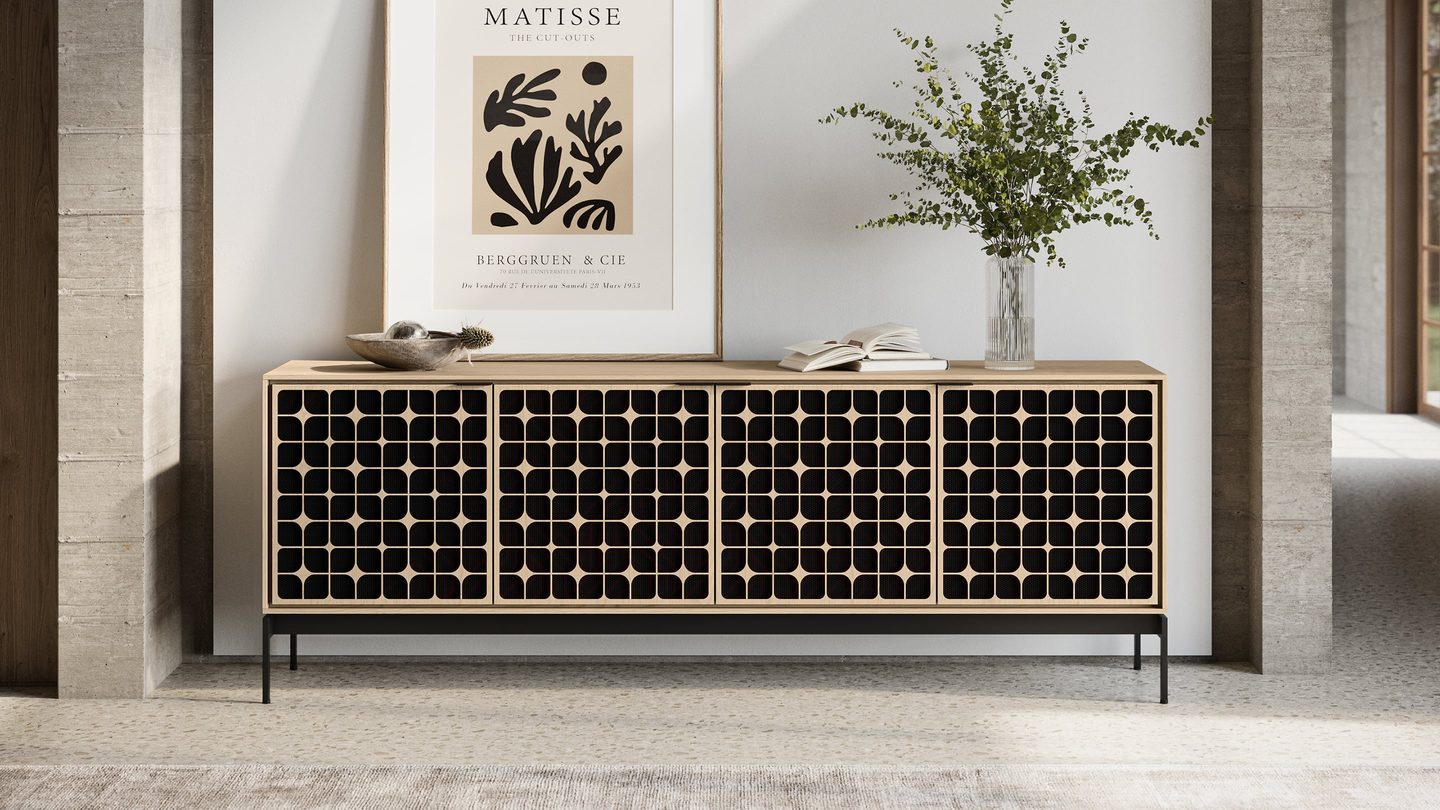 The Elements modern media cabinet and storage console by BDI Furniture is shown with its doors closed in a living room. It has a washed oak finish and precision-cut Constellation door pattern.