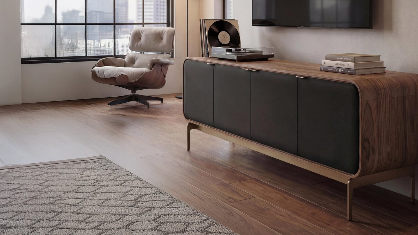 BDI Plume 8079 four-door media cabinet in Natural Walnut with black acoustic doors, rounded wood profile, and bronze base in a modern living room.