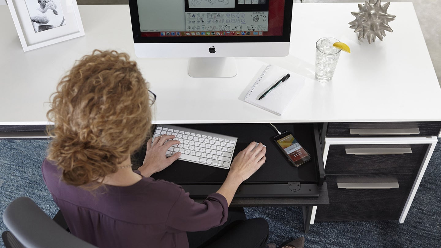 Format modern home office desk by BDI, shown with built-in keyboard drawer.