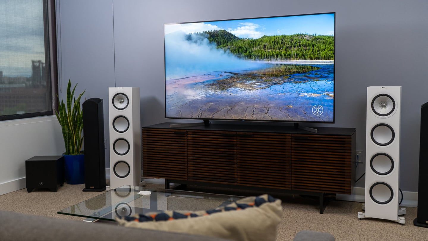 BDI Corridor 8179 modern TV stand with white speakers and 4K LG television.