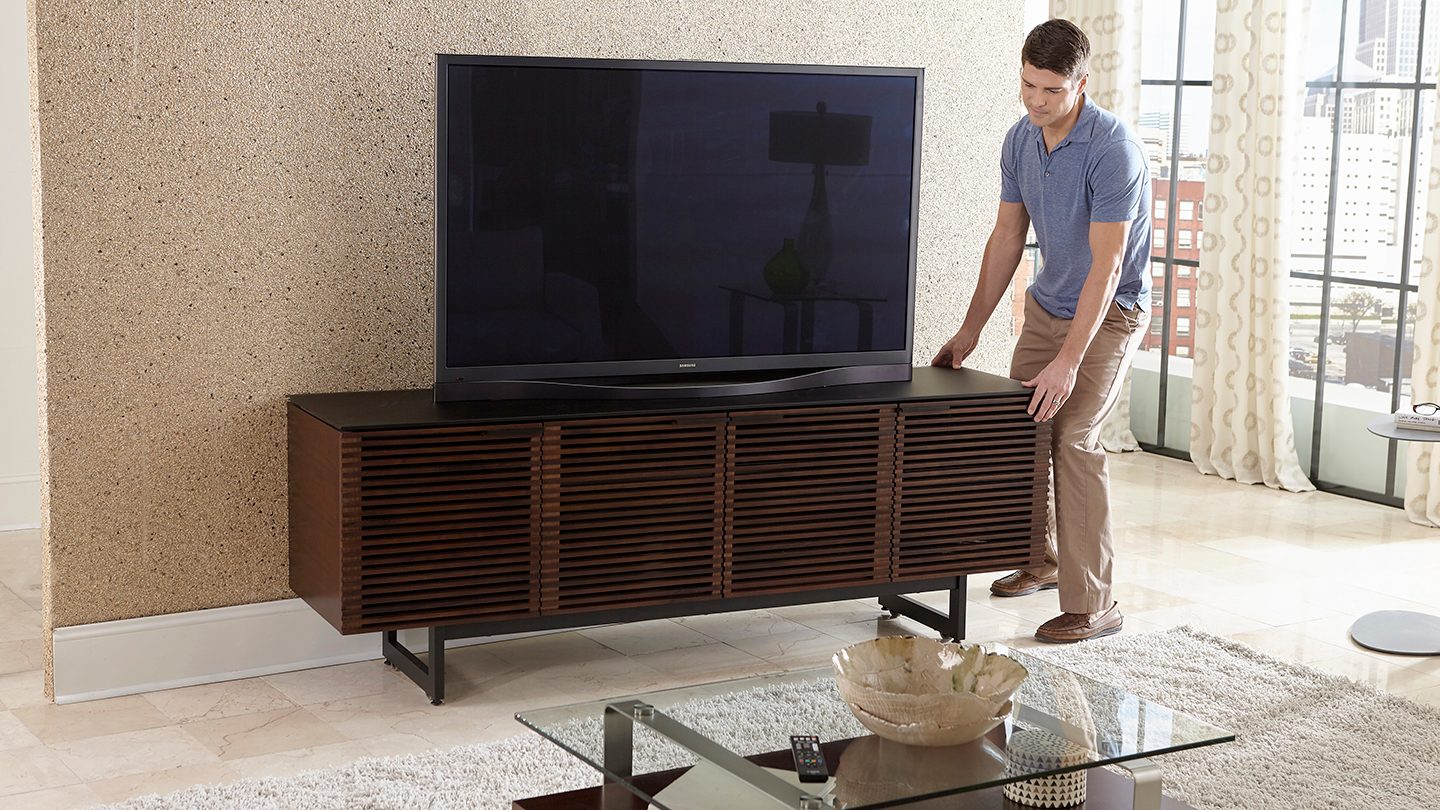 Corridor 8179 modern media console and TV stand in chocolate stained walnut finish, and featuring hidden wheels.