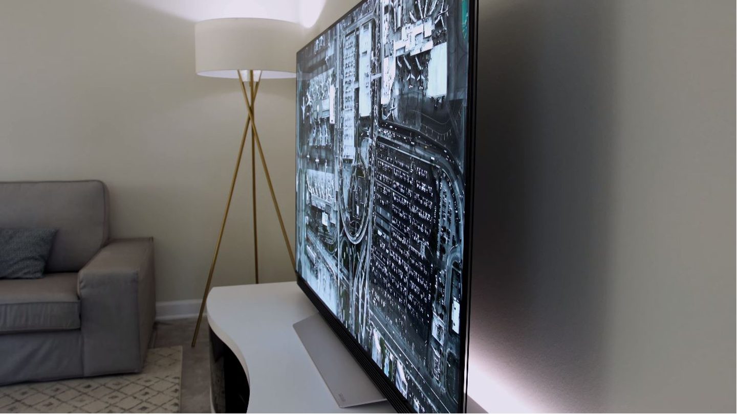 LG OLED television on a modern white Ola TV stand by BDI Furniture.