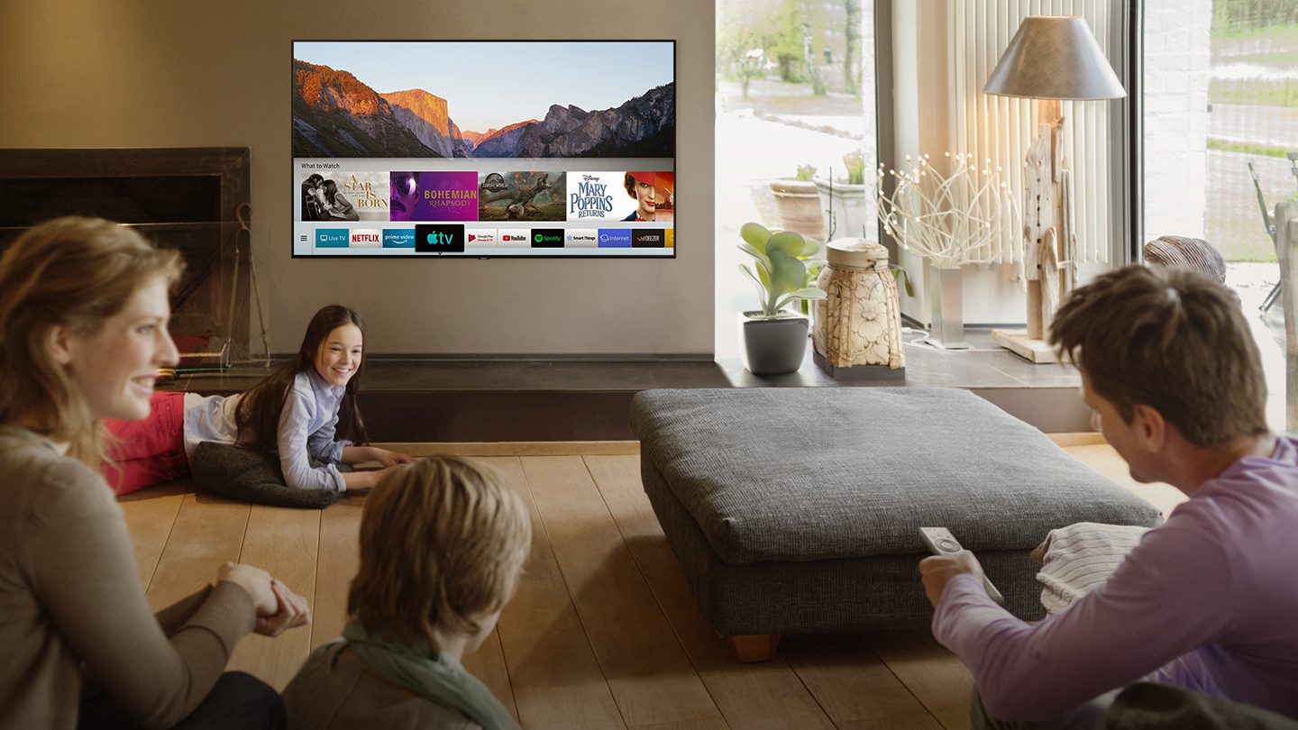 Family gathered around the television.