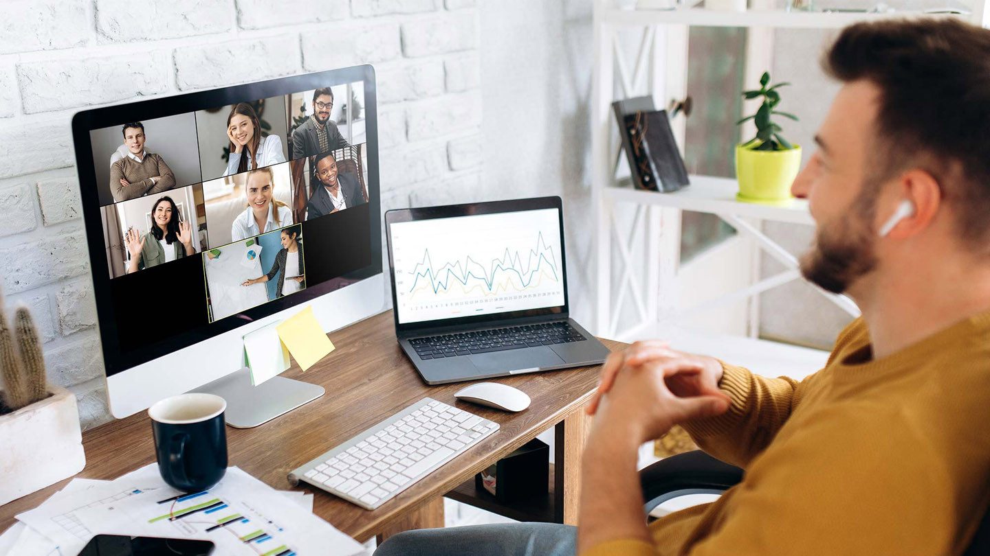 Man working from home on a Zoom conference call.
