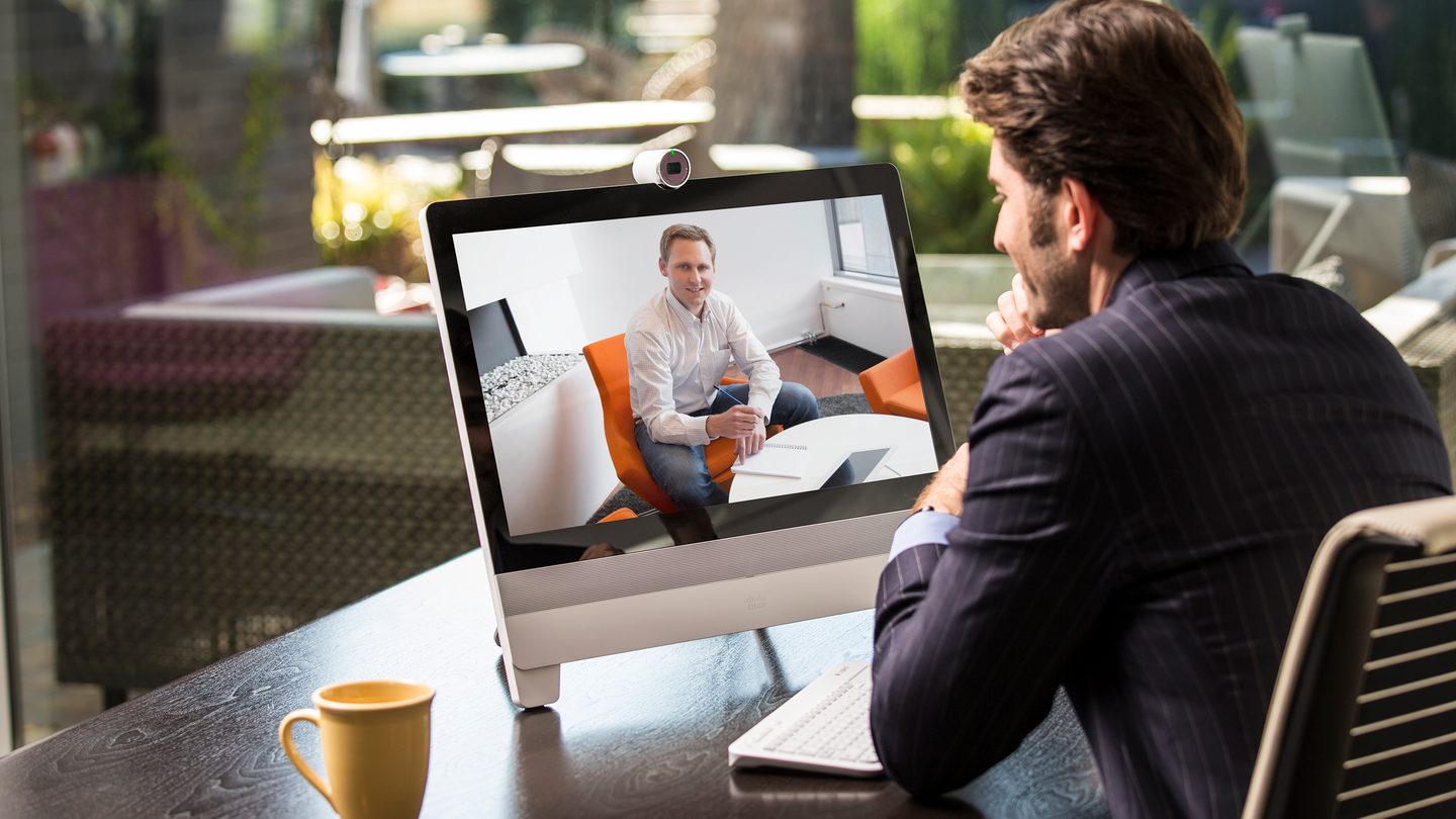 Two men video conferencing.