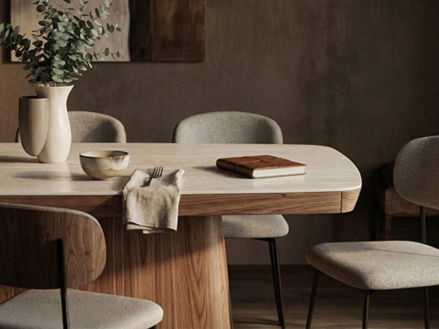 BDI Halcyon 7708 dining table with Travertine sintered stone top, Natural Walnut pedestal, and Cove dining chairs.