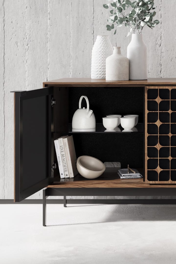 An Elements 8709 storage credenza with a console base is shown with one door open to reveal storage for everyday items. The cabinet features the Constellation door pattern and natural walnut finish.