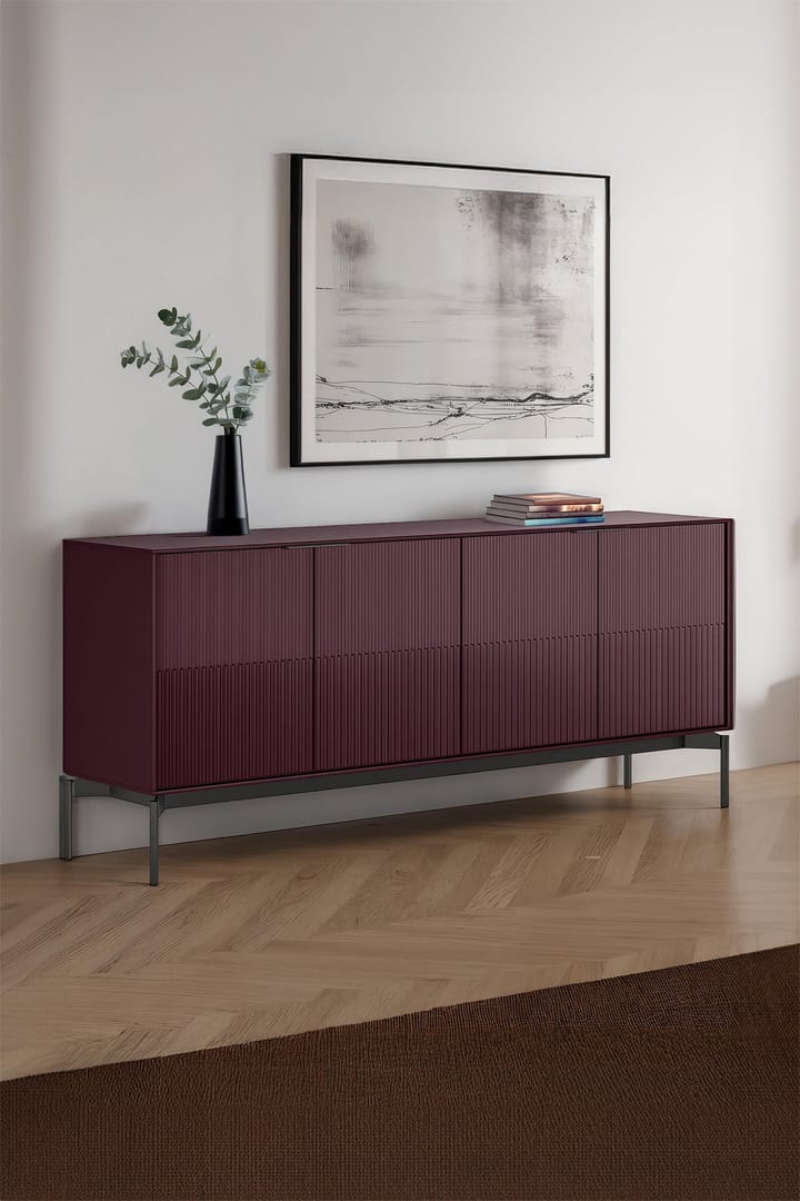 Zig credenza in Merlot finish with Brushed Carbon base, styled against a wall with a vase and framed artwork above.