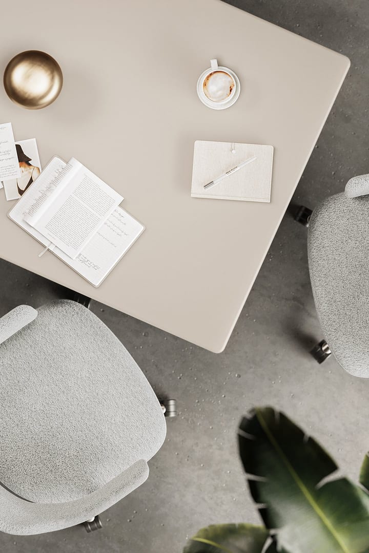 Overhead view of the BDI Luma Desk in Dune, highlighting the fingerprint-resistant satin-etched glass top.
