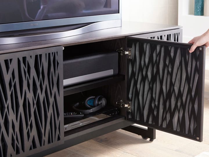 Cabinet doors specially designed to allow sound and remote signals to flow through help hide components inside while giving you full access to everything within.