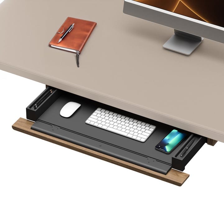 Close-up of the optional Luma Keyboard+Storage Drawer with lined interior, mousepad surface, and side storage compartments.