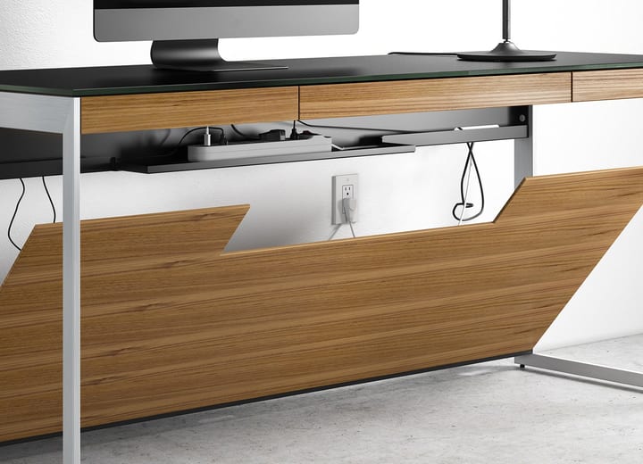 The BDI Sequel 6103 compact desk features an included front and optional back easy-access panels that conceal cords and cables and can be tilted down for convenient access to all of your connections.