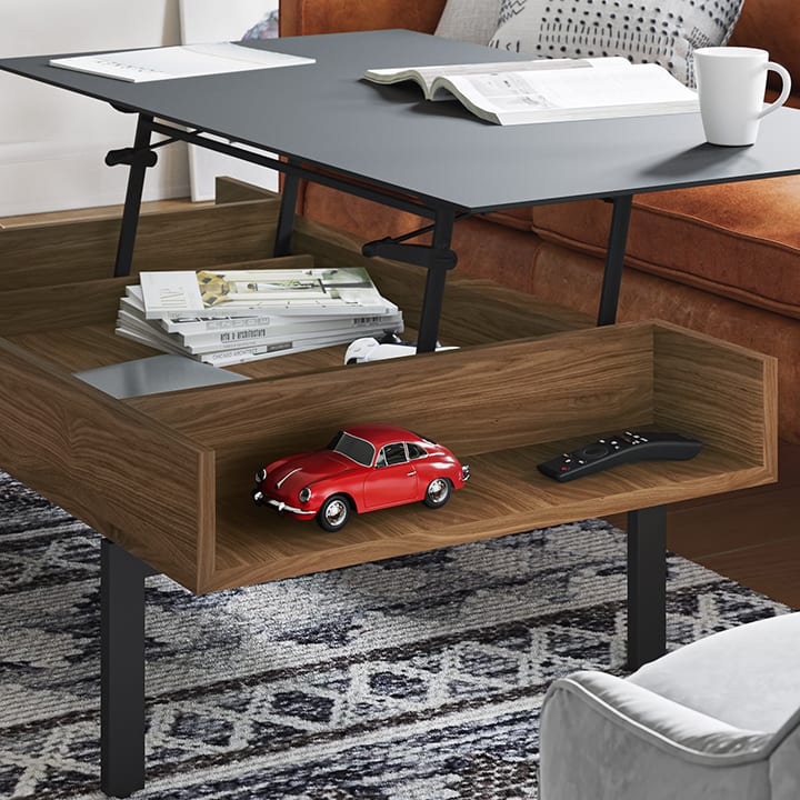 Reveal's side storage is ideal for easy access to smaller items like remotes and game controllers, while the larger concealed storage is perfect for a laptop, books, or other neatly tucked away items.