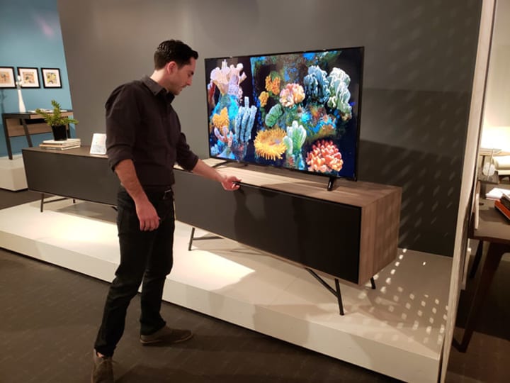 Associate Design Director, Matthew Weatherly, discussing the design features of the Sector media cabinet.