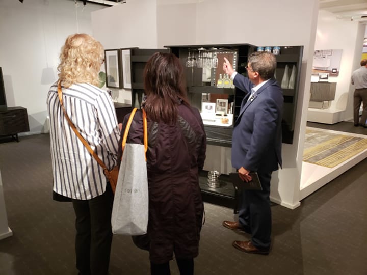 Customer Relations Manager, Dave Jacobs, discussing the design features of the Cosmo home bar by BDI.