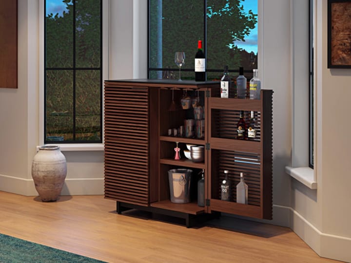 The Corridor home bar in chocolate stained walnut, but BDI Furniture.