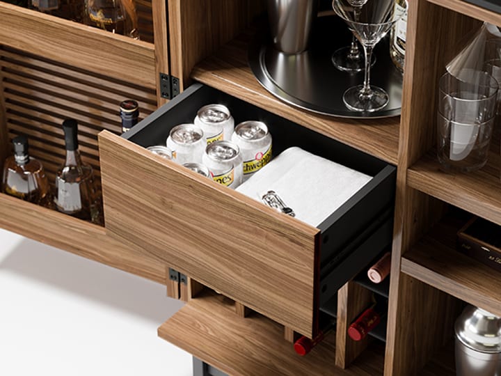 Home bar storage drawer on the Corridor Bar by BDI in natural walnut finish.