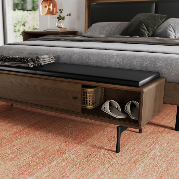 Leather upholstered LINQ bedroom bench by BDI with hidden storage, providing a discreet place to organize everyday items while keeping the space uncluttered.