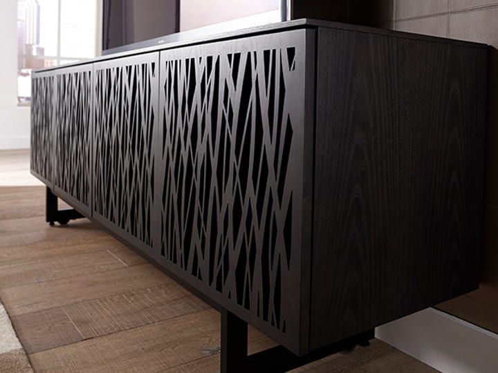Elements TV console and media stand, featuring Wheat laser cut wood doors, in Charcoal finish.