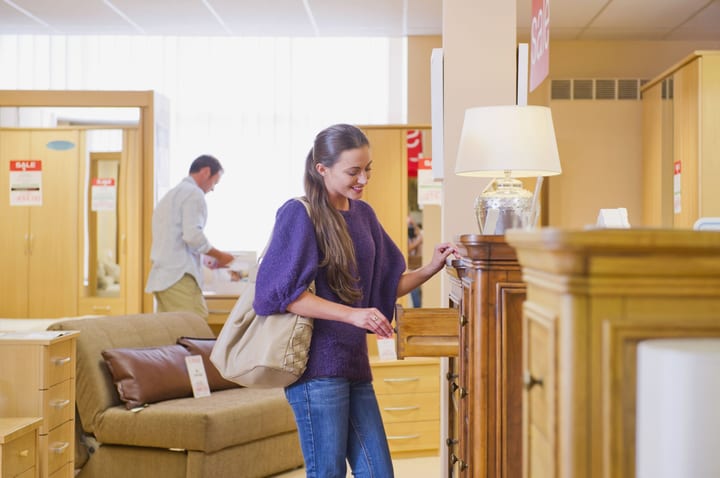 Attractive couple shopping in a local furniture store